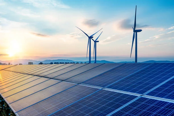 Solar panels and wind turbines producing renewable energy